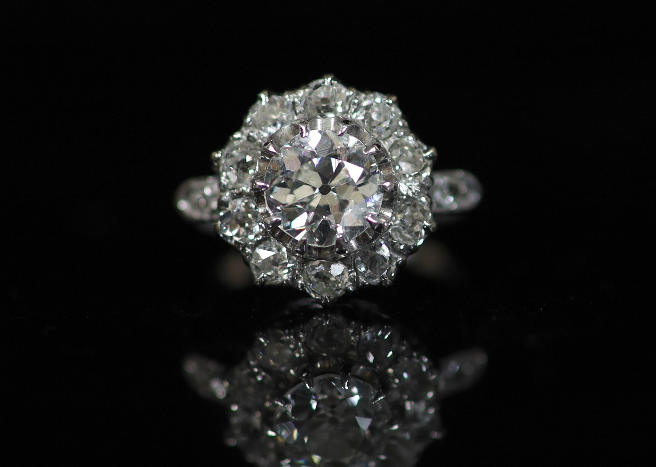 An 18ct white gold, platinum and diamond set cluster ring